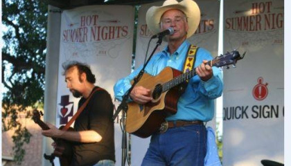 Rj Vandygriff Performing on Stagine With Guitar and Bassist